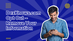 Man in denim shirt looking down at his mobile phone