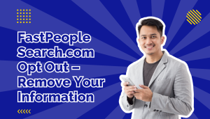 Man in grey blazer smiling and holding cell phone