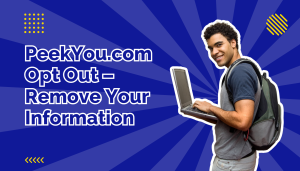 Man in blue and grey t-shirt wearing a backpack and holding a laptop