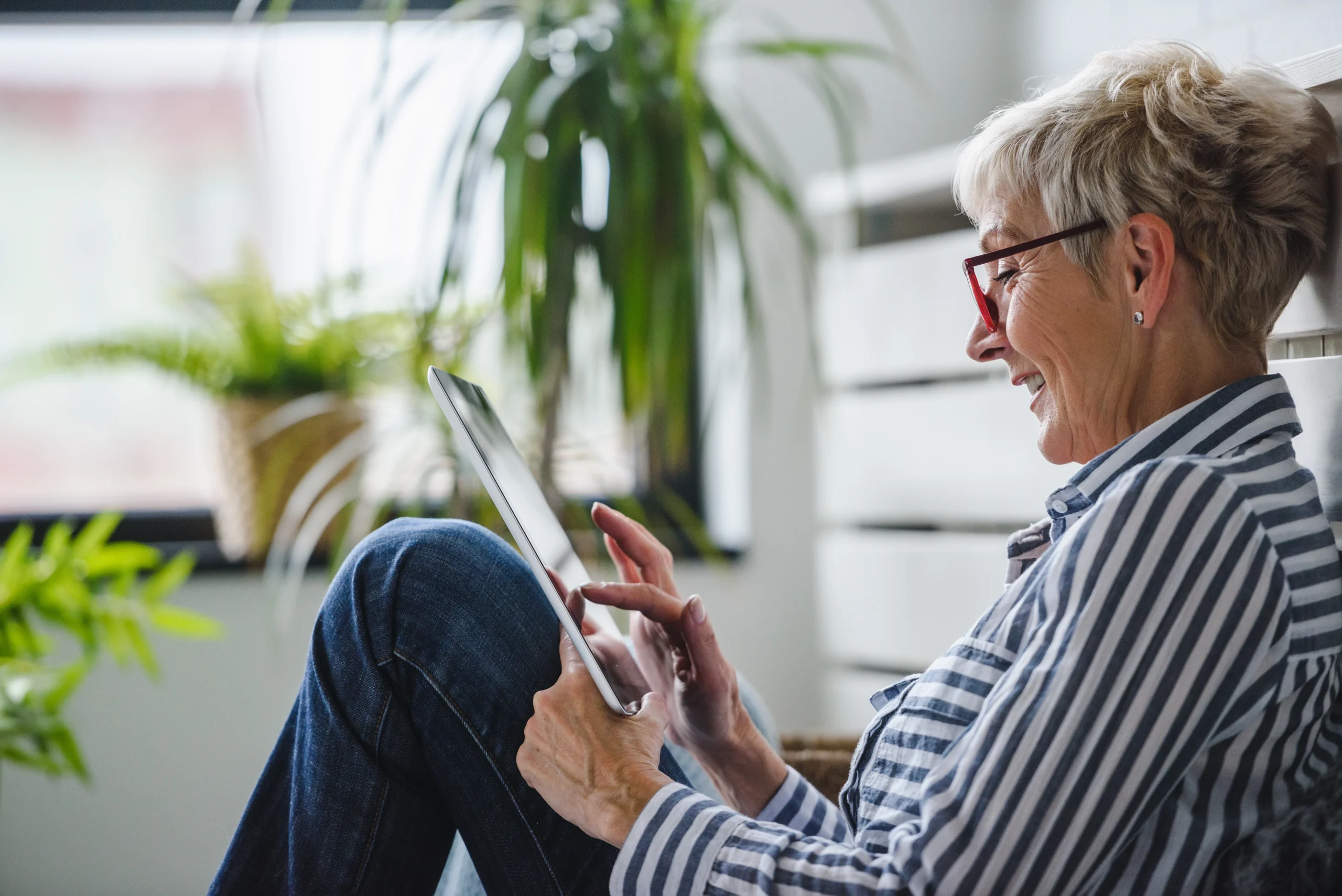 woman sitting on the floor using a tablet