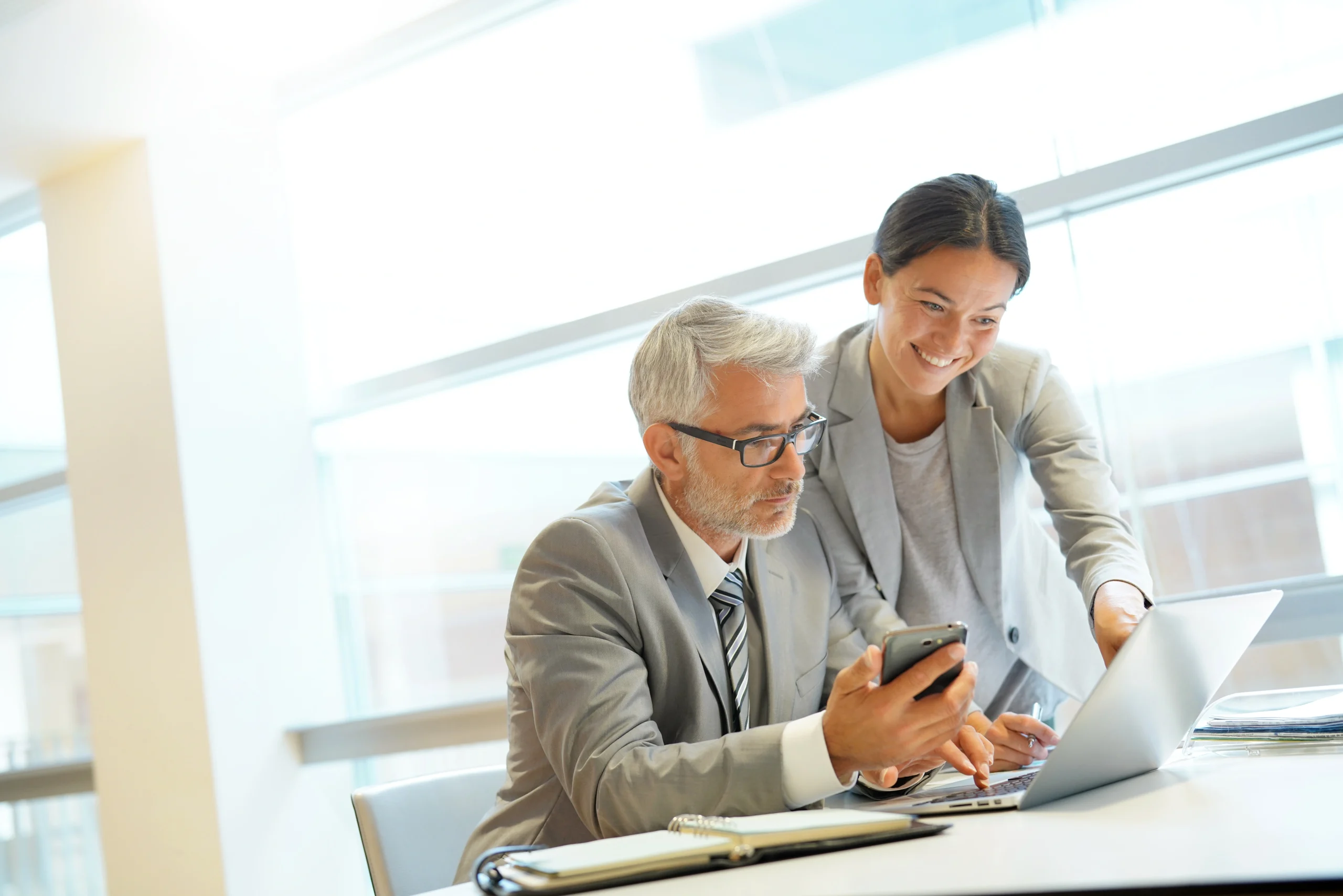 two people working together on a problem